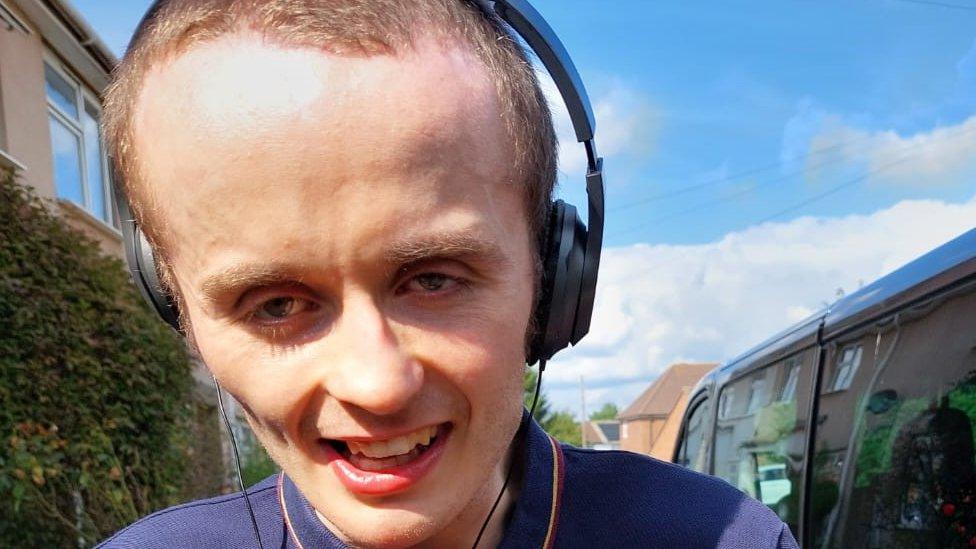 Callum with headphones on