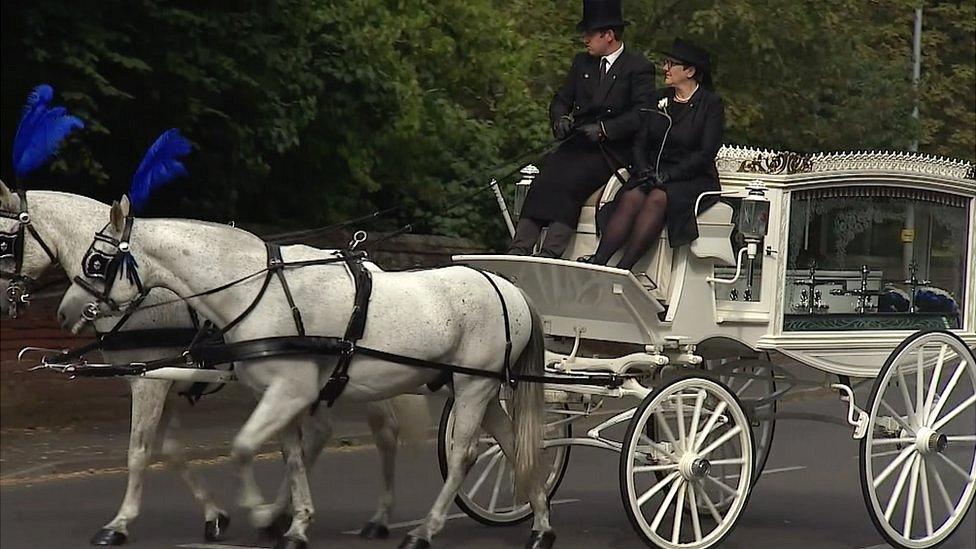 Freddie Farrow's coffin arriving by horse-drawn carriage.