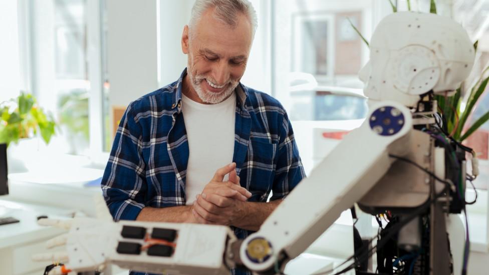 Older person with robot