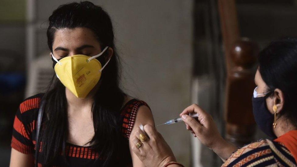 A woman being vaccinated in Gurugram, India