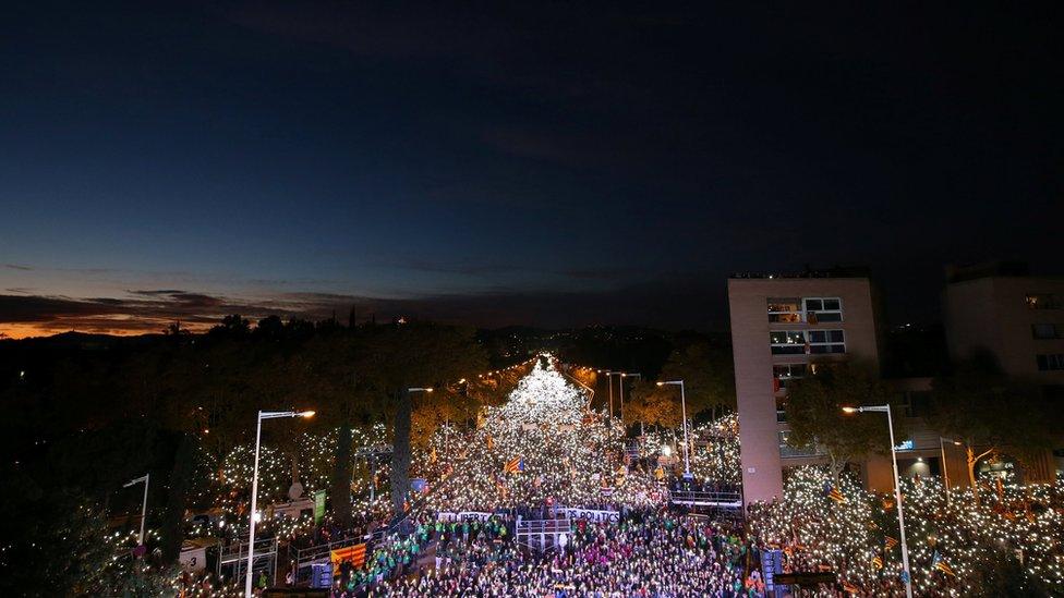 Protesters shine their mobile phone torches in Barcelona, 11 November