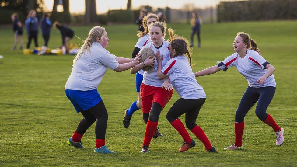 Girls playing rugby