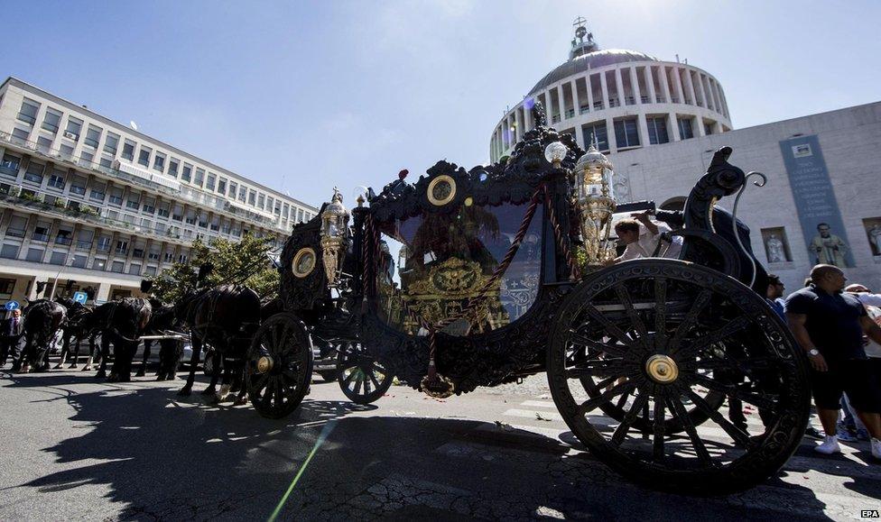 People attend the funeral procession of alleged mafia member Vittorio Casamonica, outside Don Bosco church in Rome, Italy, 20 August 2015