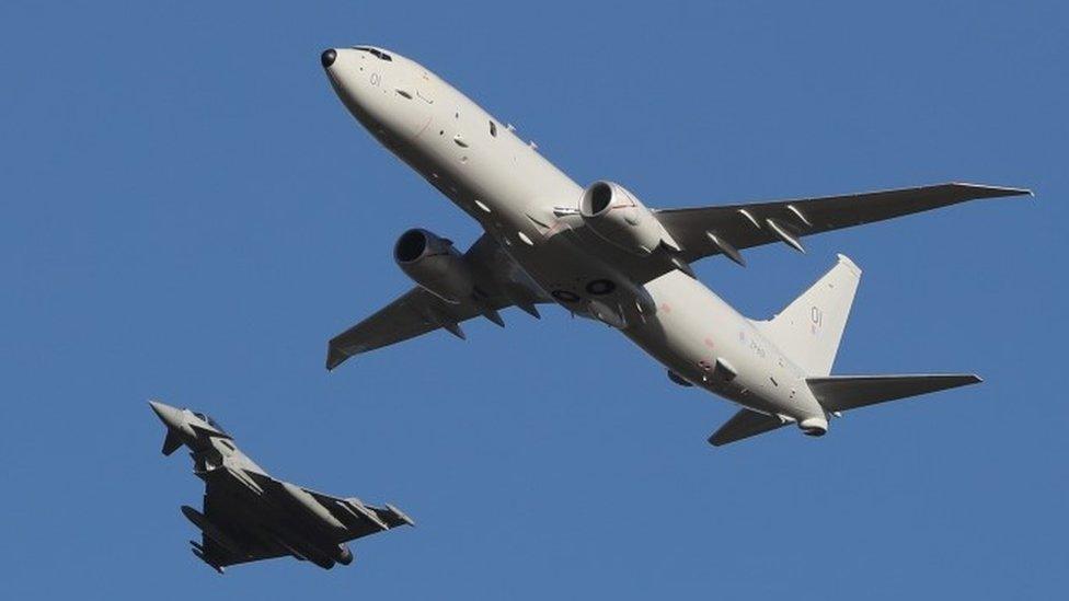 P-8A Poseidon being escortted by an RAF Typhoon