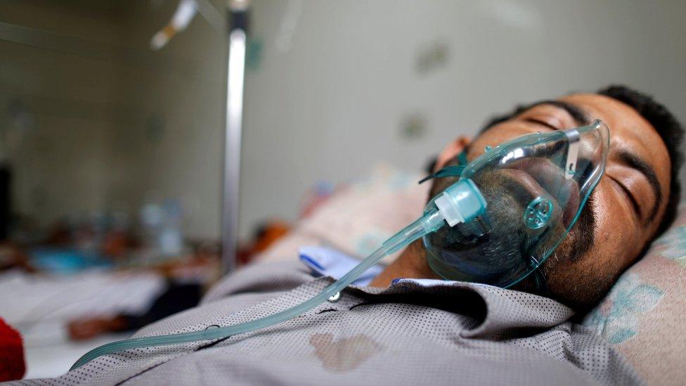 A man infected with cholera lies on a bed at a cholera treatment centre in Sanaa, Yemen (15 May 2017)