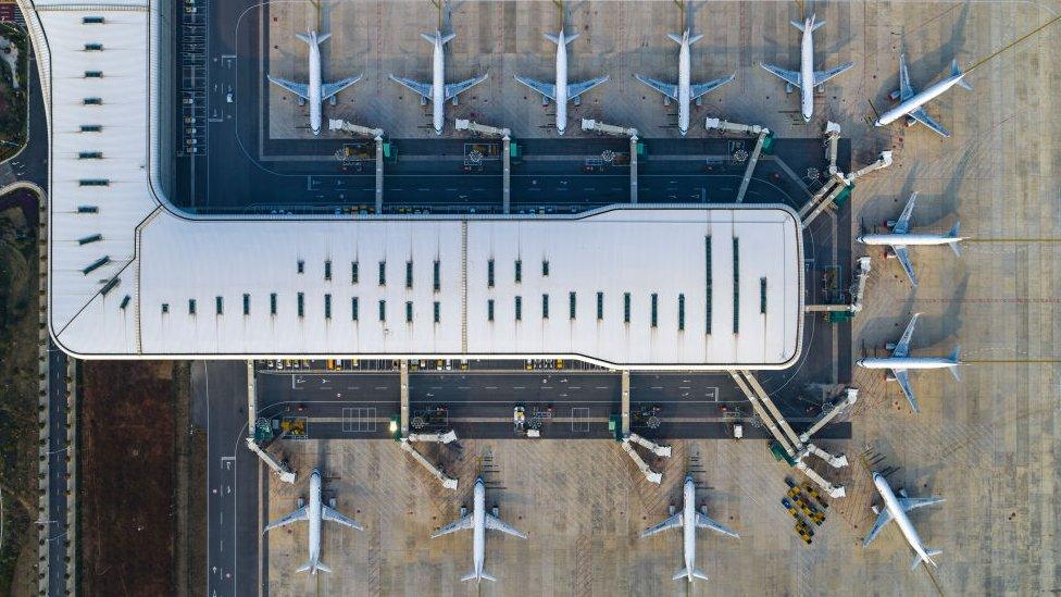 aerial view of the passenger planes and terminal building of Wuhan Tianhe International Airport in China