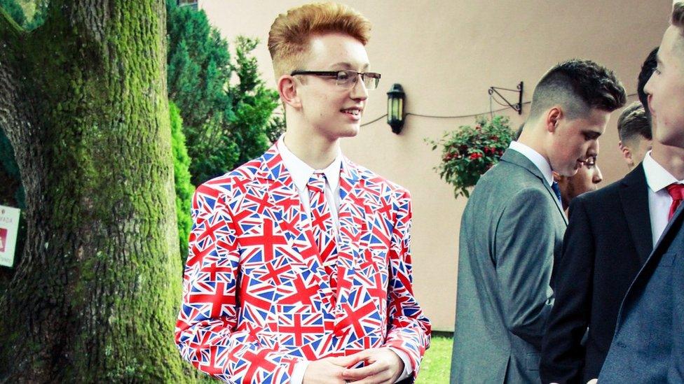 Alexander Willis at his school prom in a suit decorated with Union Jack flags