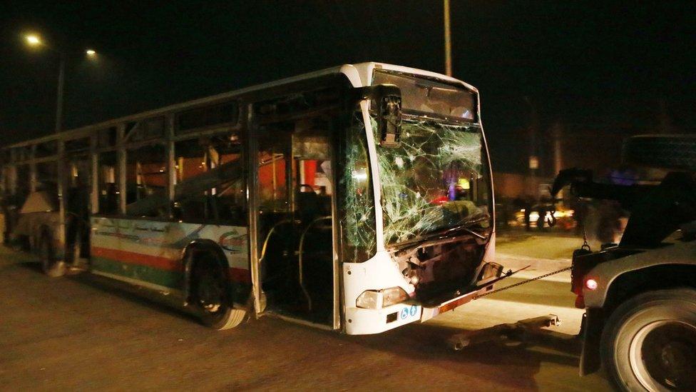 A bus is removed from the scene of the bombings in Kabul. 10 Jan 2017