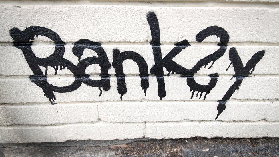 Graffiti of Banksy's name.