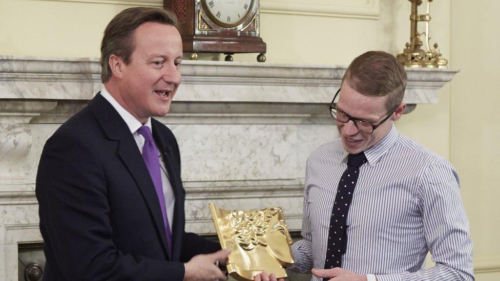 Simon Bayliss receiving the award