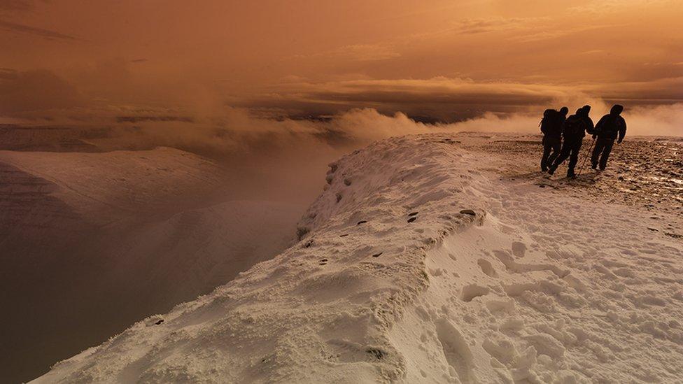 Walkers on Pen y Fan in the snow