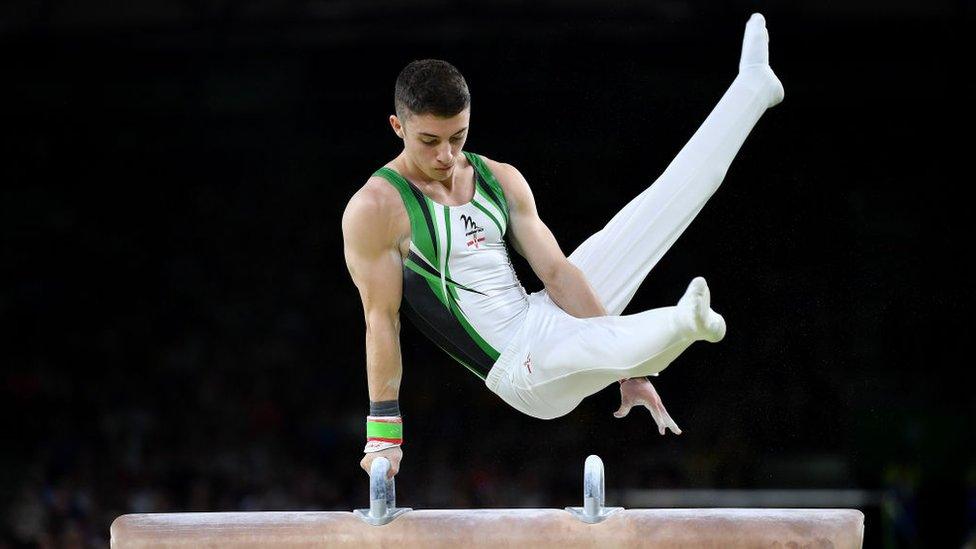 rhys mcclenaghan on a pommel horse performing a routine