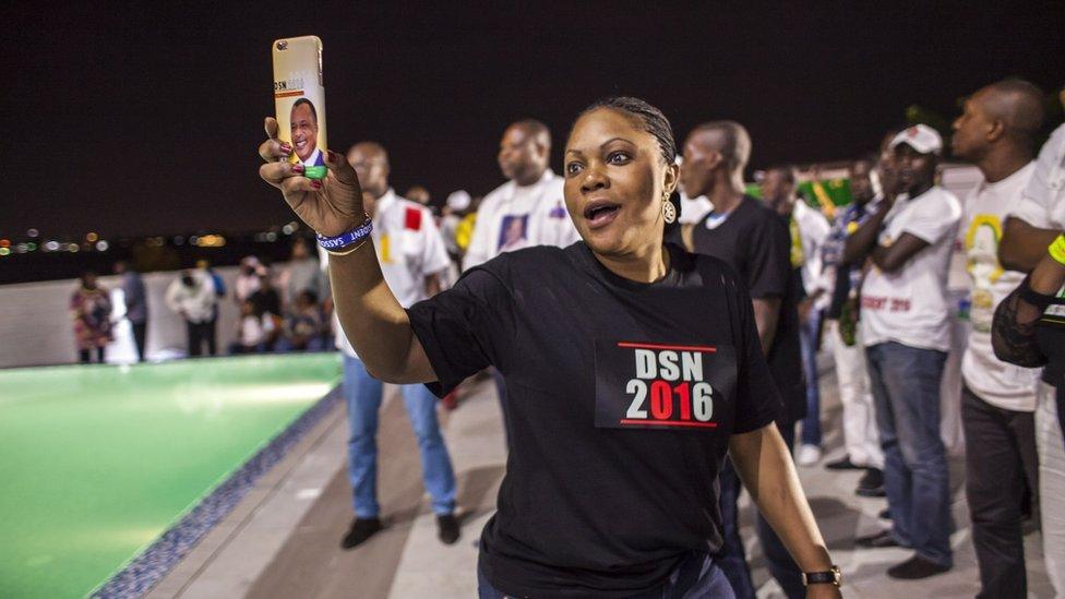 A supporter of incumbent Congolese President Denis Sassou Nguesso celebrates after the announcement of the final results of a presidential election in Brazzaville, Congo-Brazzaville - Wednesday 23 March 2016