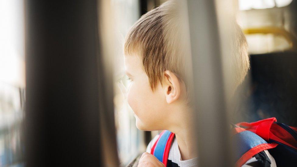 Stock image of a child on a bus