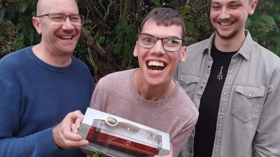 Alex Chesters (centre, with father Darren, left, and brother Will, right)