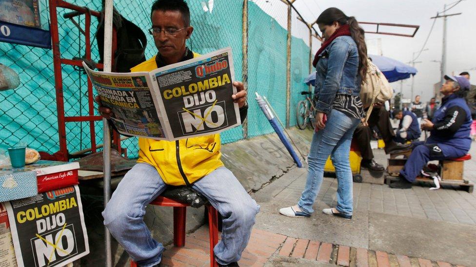 A man reads a newspaper with the headline that reads in Spanish: "Colombia said No" in Bogota, Colombia, Monday, Oct. 3, 2016