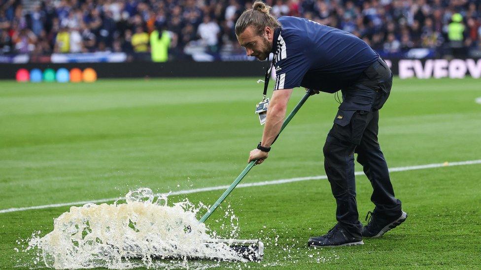 Pitch staff clearing the water