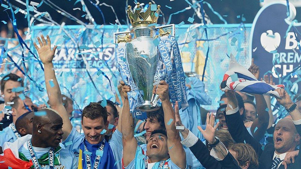 Aguero lifting the Premier League trophy in 2012