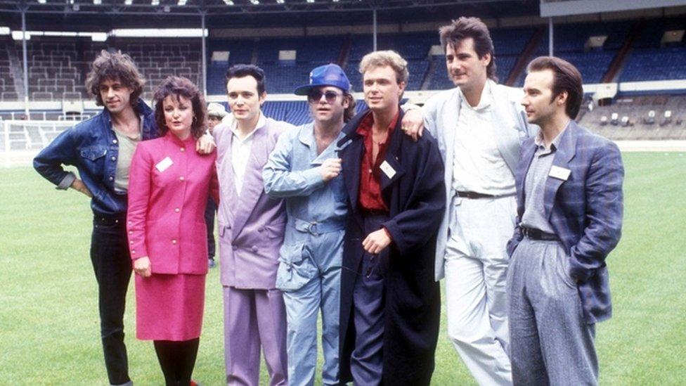 Bob Geldof, Janice Long, Adam Ant, Elton John, Gary Kemp, Tony Hadley and Midge Ure pictured as part of Band Aid, 1984