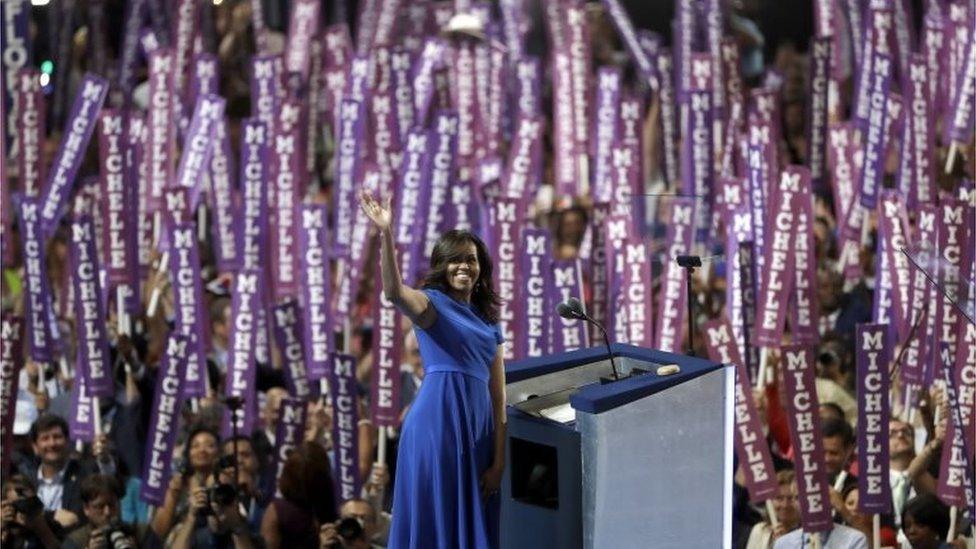 First Lady Michelle Obama waves as she speaks to delegates during the first day of the Democratic National Convention.