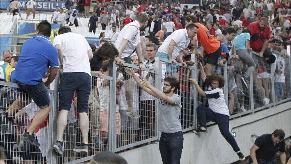 Fans escape a charge by Russian supporters