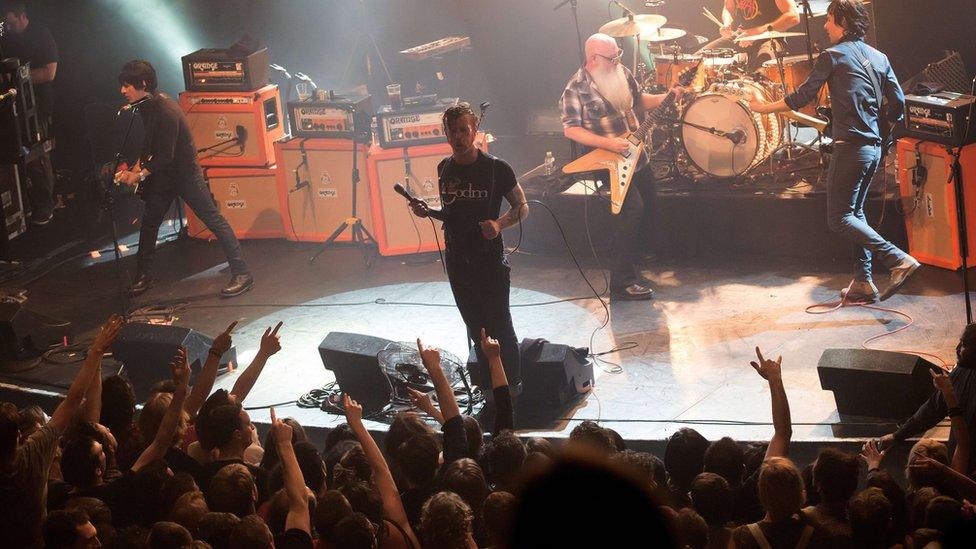 Eagles of Death Metal perform on stage on 13 November 2015 at the Bataclan concert hall in Paris