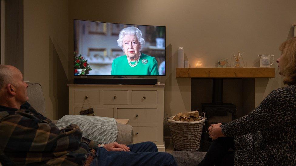 People in Leicester watch the Queen deliver her address