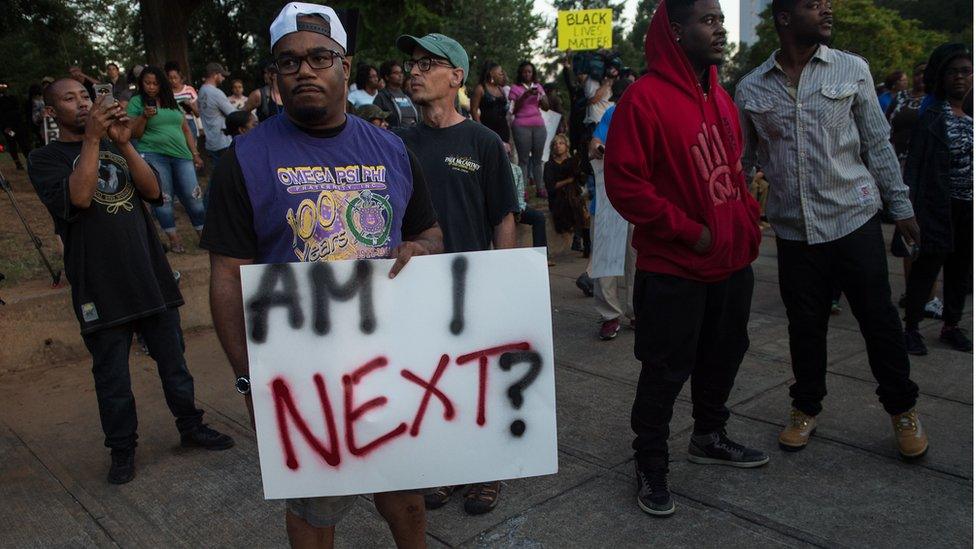 Protesters attend a demonstration against police brutality in Charlotte, North Carolina, on September 21, 2016, following the shooting of Keith Lamont Scott the previous day