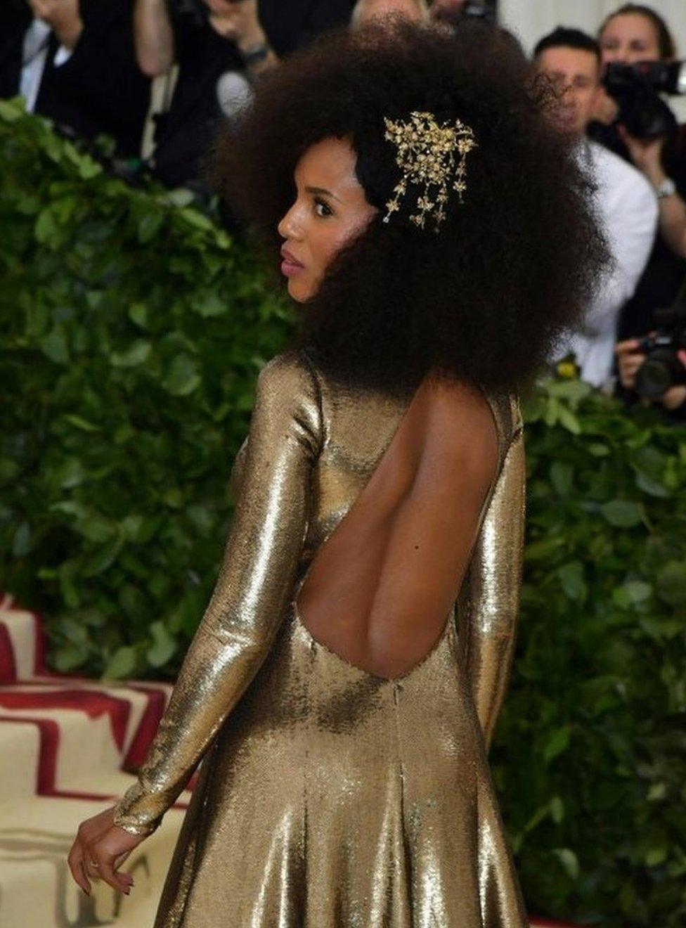 Actress Kerry Washington delights onlookers in a gold-sequined gown.