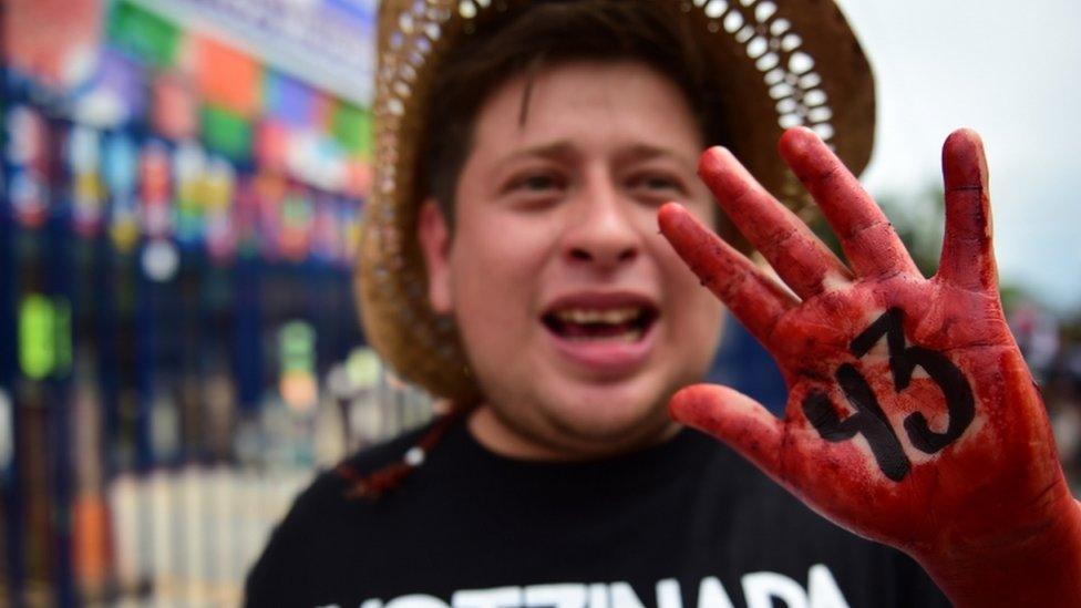 Relatives and friends of the 43 missing students from Ayotzinapa take part in a demonstration in Iguala