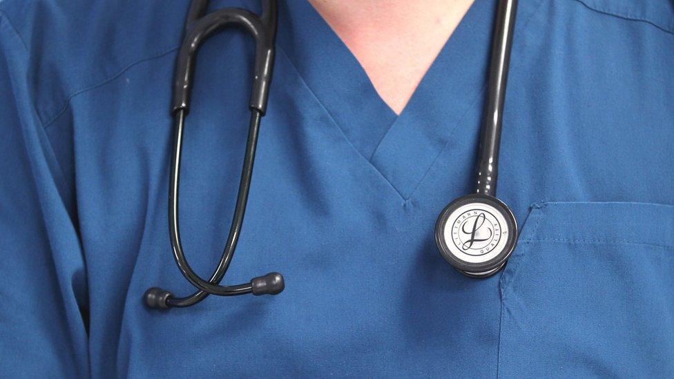 Stock photo of nurse with stethoscope around neck