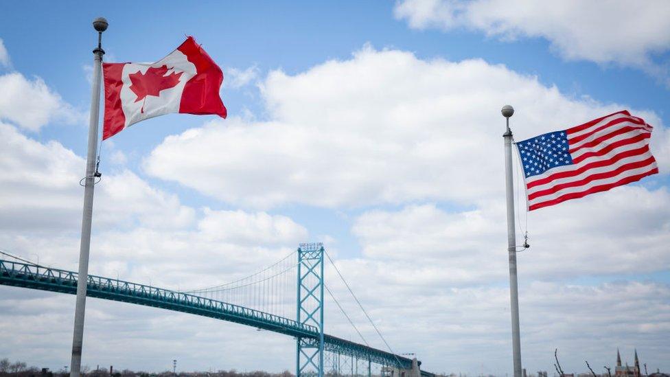 The Ambassador Bridge spans the Detroit River to connect Windsor, Ontario, to Detroit, Michigan Friday, April 10, 2020