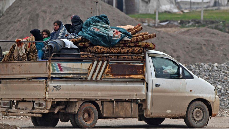 Displaced Syrians arrive at a camp near Deir Ballut, close to the Turkish border (11 February 2020)