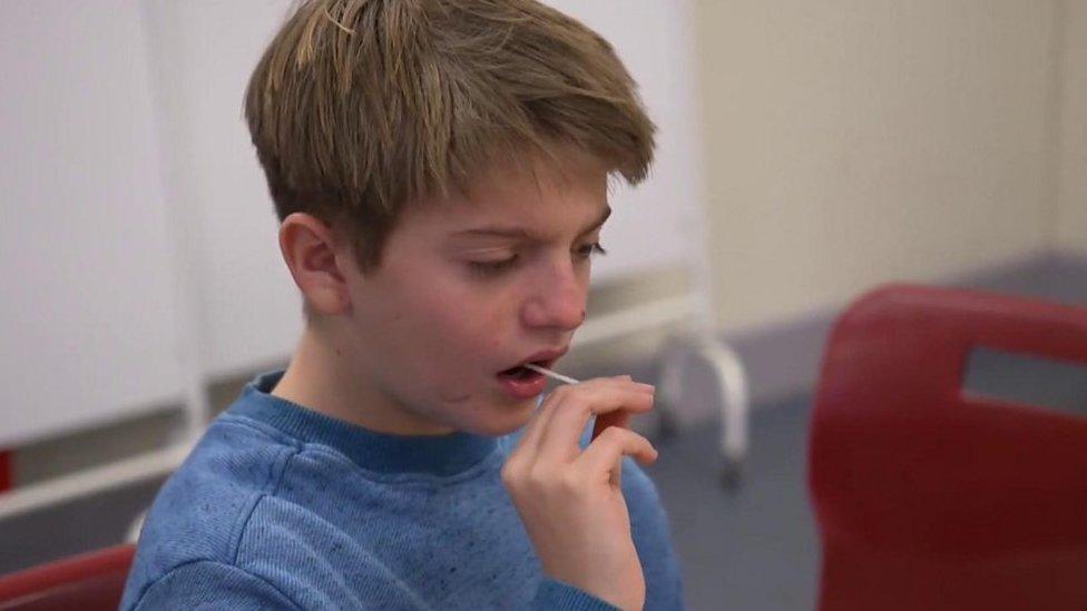 Boy doing swab