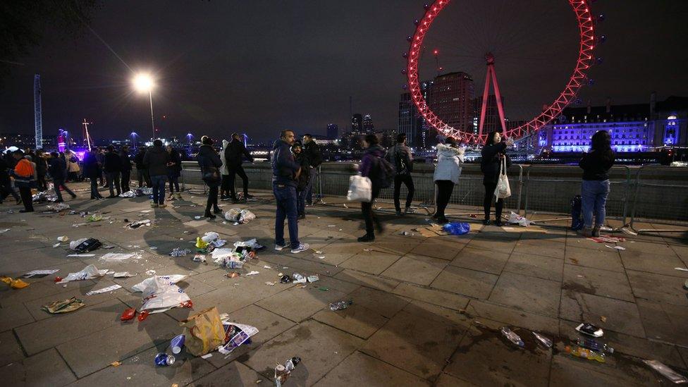 Revellers head home from central London following the fireworks display