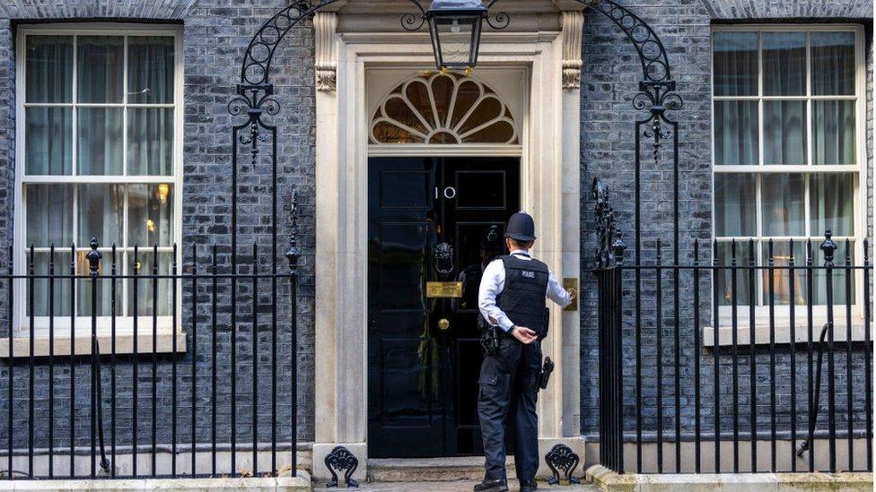 Police officer entering No 10