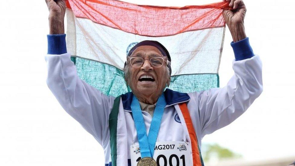 101-year-old Man Kaur from India celebrates after competing in the 100m sprint in the 100+ age category at the World Masters Games at Trusts Arena in Auckland on April 24, 2017.