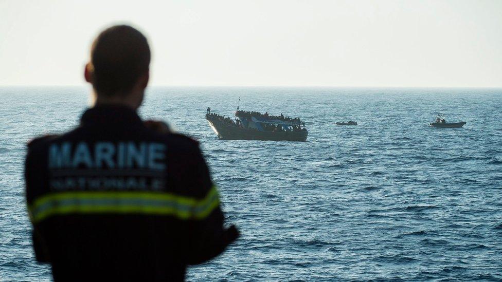 A handout picture provided by the Marine Nationale Francaise (French Navy) on 07 September 2015 shows the French Navy crew of the "Commandant Bouan" patrol vessel rescuing migrants during the EU sea patrol mission Triton/Frontex, from southern Italy to southern Malta, in the Mediterranean Sea, on 05 September 2015