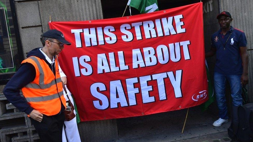 Union members man a picket line at Victoria station