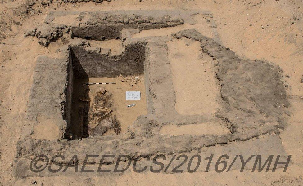 Picture shows what has been described as a grave in a city unearthed in southern Egypt that has been described as more than 5,000 years old.