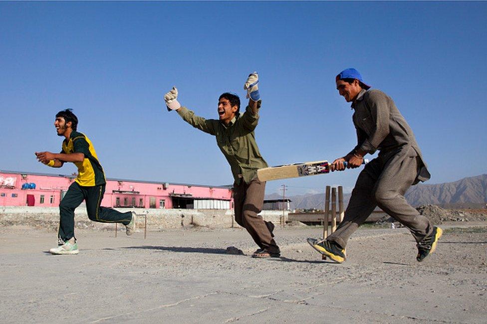 Afghan cricket players celebrate a wicket June 15, 2011 in Kabul, Afghanistan. Cricket enthusiasm continues to grow as Out of the Ashes, a documentary film about the Afghan cricket team's efforts to qualify for the sport's World Cup, gains more attention and awards. In the early 1990's, cricket quickly grew as a popular among Afghan refugees living in Pakistan. In 1995 the Afghanistan Cricket Federation was formed, but under the Taliban rule, like all sports, cricket was originally banned. Cricket became an exception in 2000 and the following year the Afghanistan Cricket Federation was elected as an affiliate member of the ICC. (