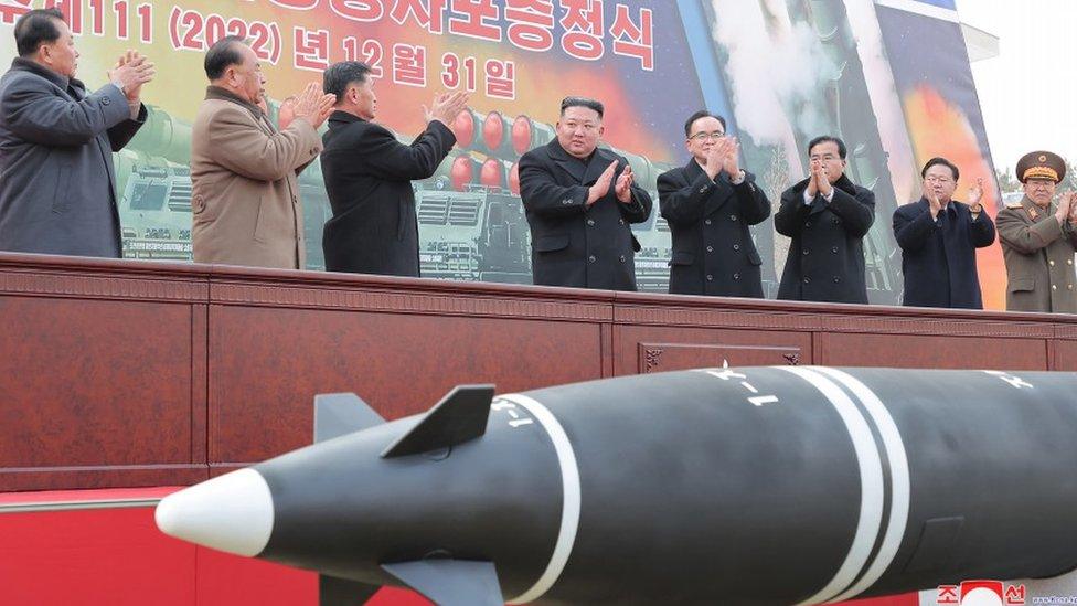 Kim Jong-un (fourth from left) at a meeting