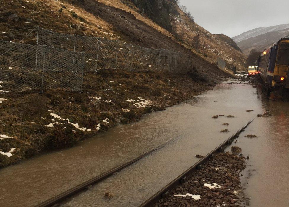 Train trapped in landslide