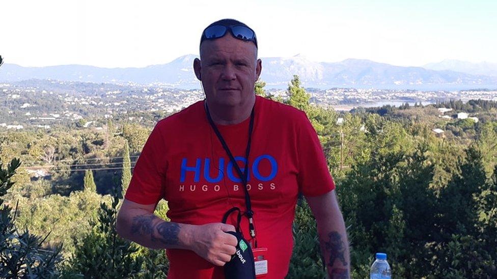 Peter Toole, 59, wearing a red t-shirt and sunglasses