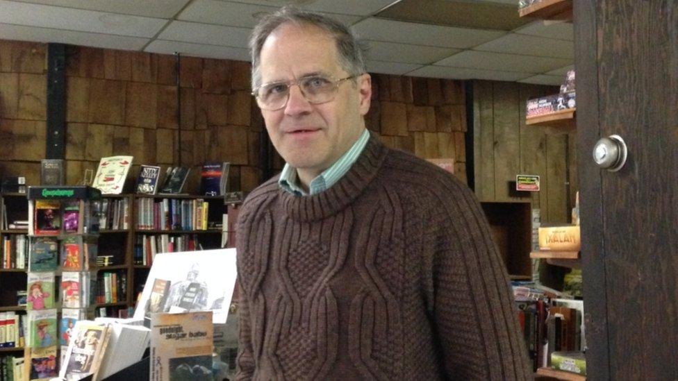 David Koehl, standing in his bookstore