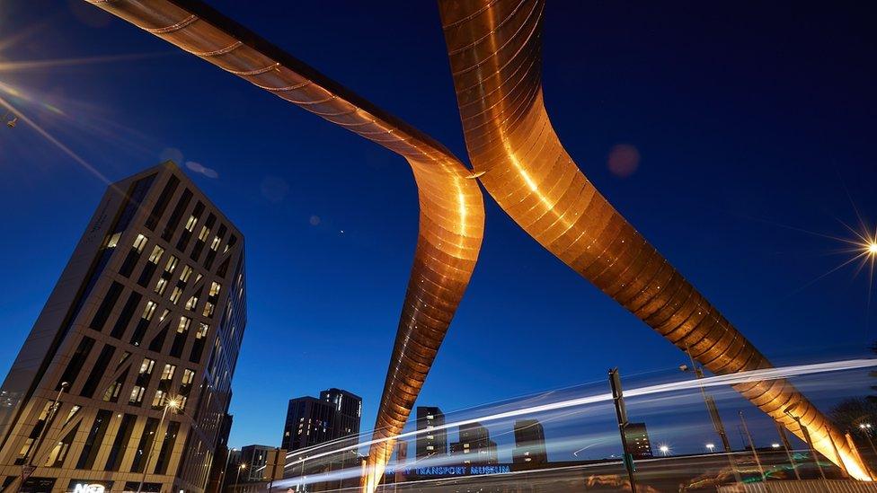 Whittle Arches lit up orange