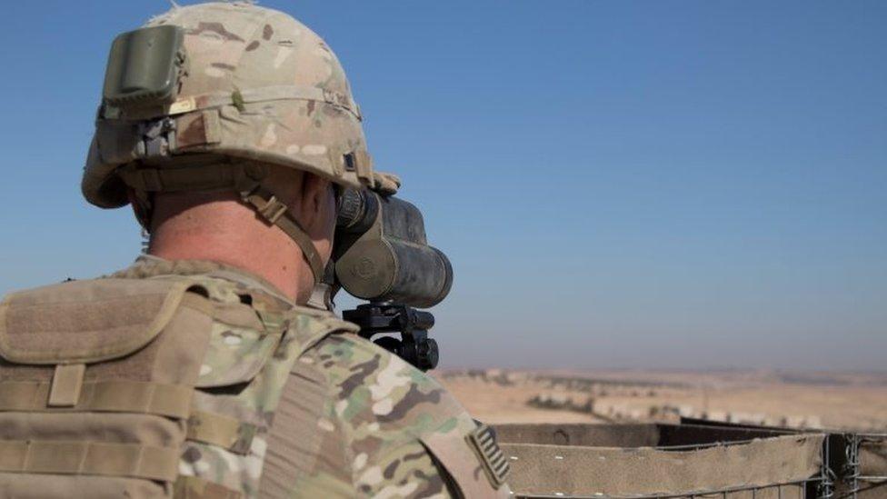 A US soldier surveys the area during a combined joint patrol in Manbij, Syria, on 1 November 2018.