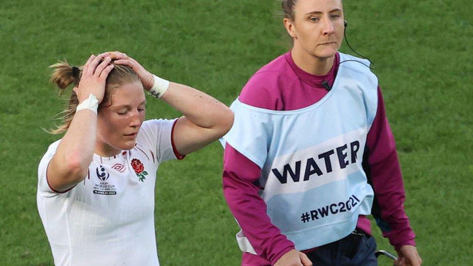 Lydia Thompson of England leaves the field after receiving a red card.