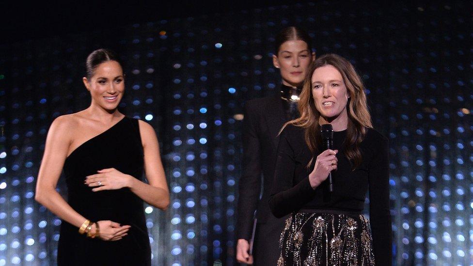 Clare Waight Keller with the Duchess of Sussex and Rosamund Pike