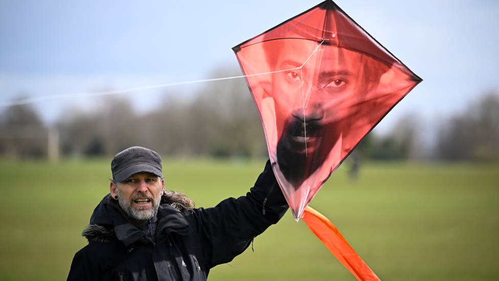 Man holiding a kite